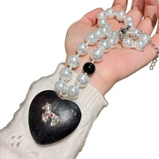 Collana di perle nere a forma di cuore