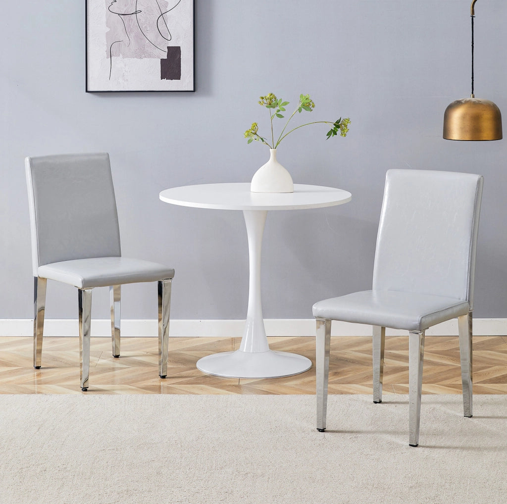 Set 2 sedie da pranzo moderne in PU grigio chiaro con gambe in metallo argentato; h 90 cm
