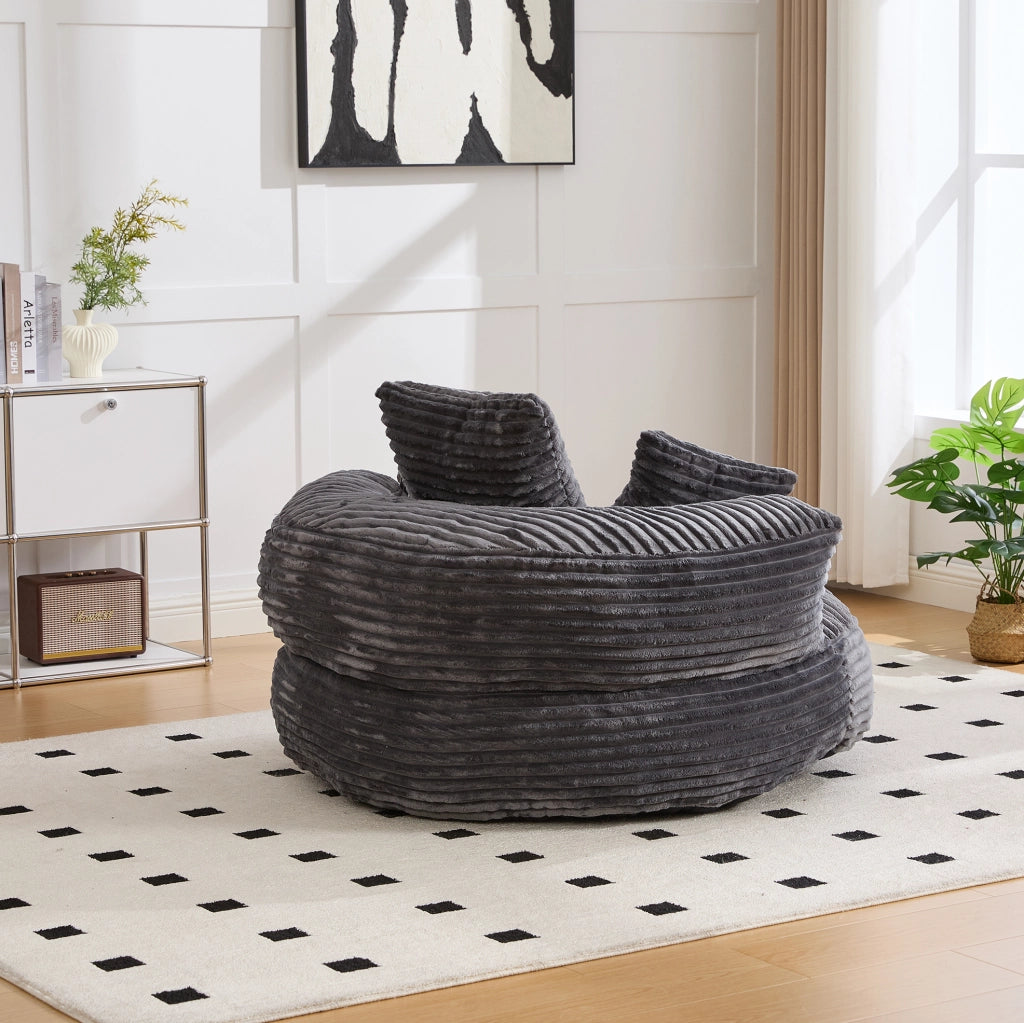 Poltrona sacco in velluto a coste con schienale alto e braccioli; 108 x 108 x 52 cm; grigio scuro