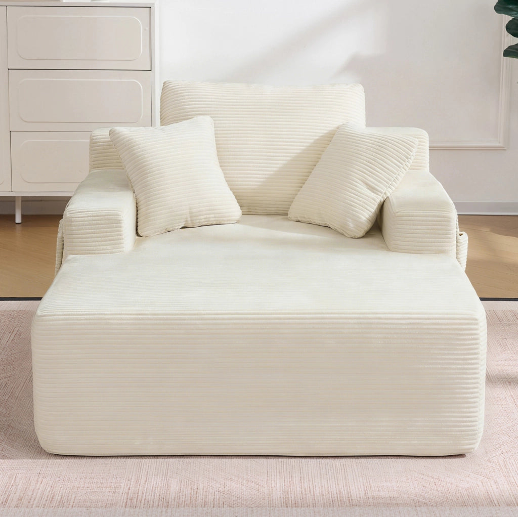 Divano in velluto a coste con tasche laterali; molle integrate e cuscini; beige