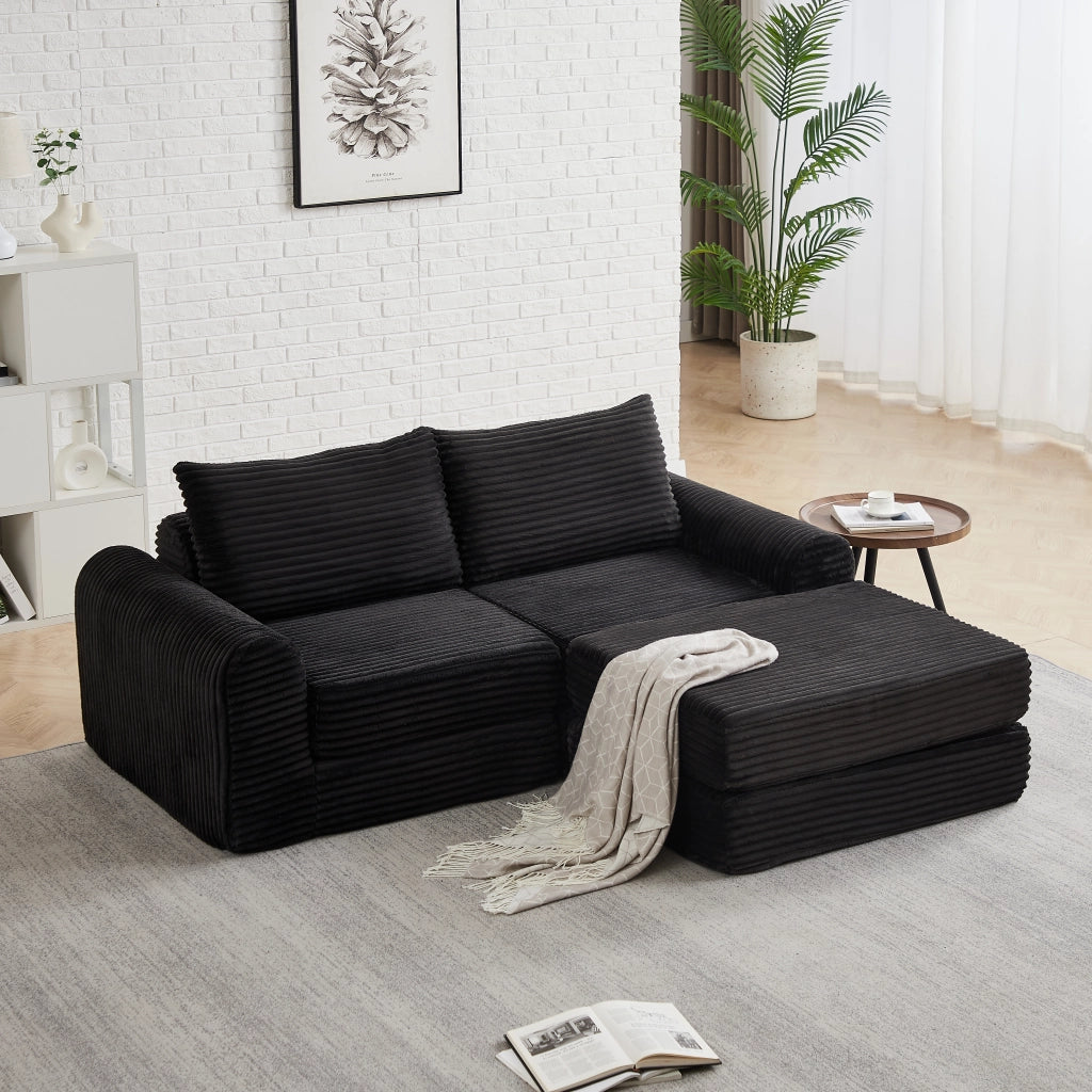 Divano letto modulare con pouf rimovibile e braccioli curvi, configurazione flessibile in velluto a coste nero