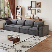 Divano modulare in tessuto grigio scuro con supporto in schiuma; design componibile