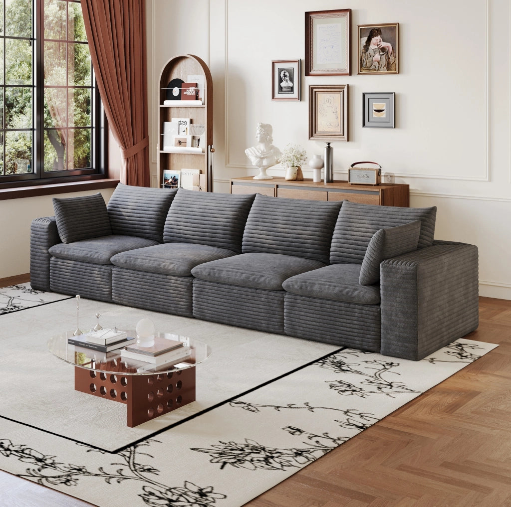 Divano modulare in tessuto grigio scuro con supporto in schiuma; design componibile