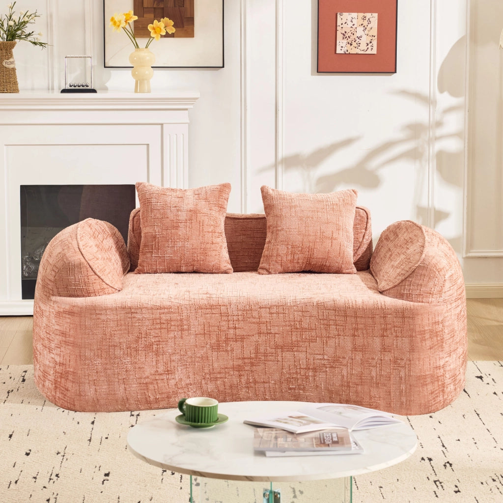Divano curvo a due posti con supporto ergonomico e cuscini, in schiuma e molle rosa per soggiorno e camera da letto
