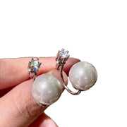 Orecchini di perle e zirconi, modello da indossare dietro la schiena, eleganti e delicati.