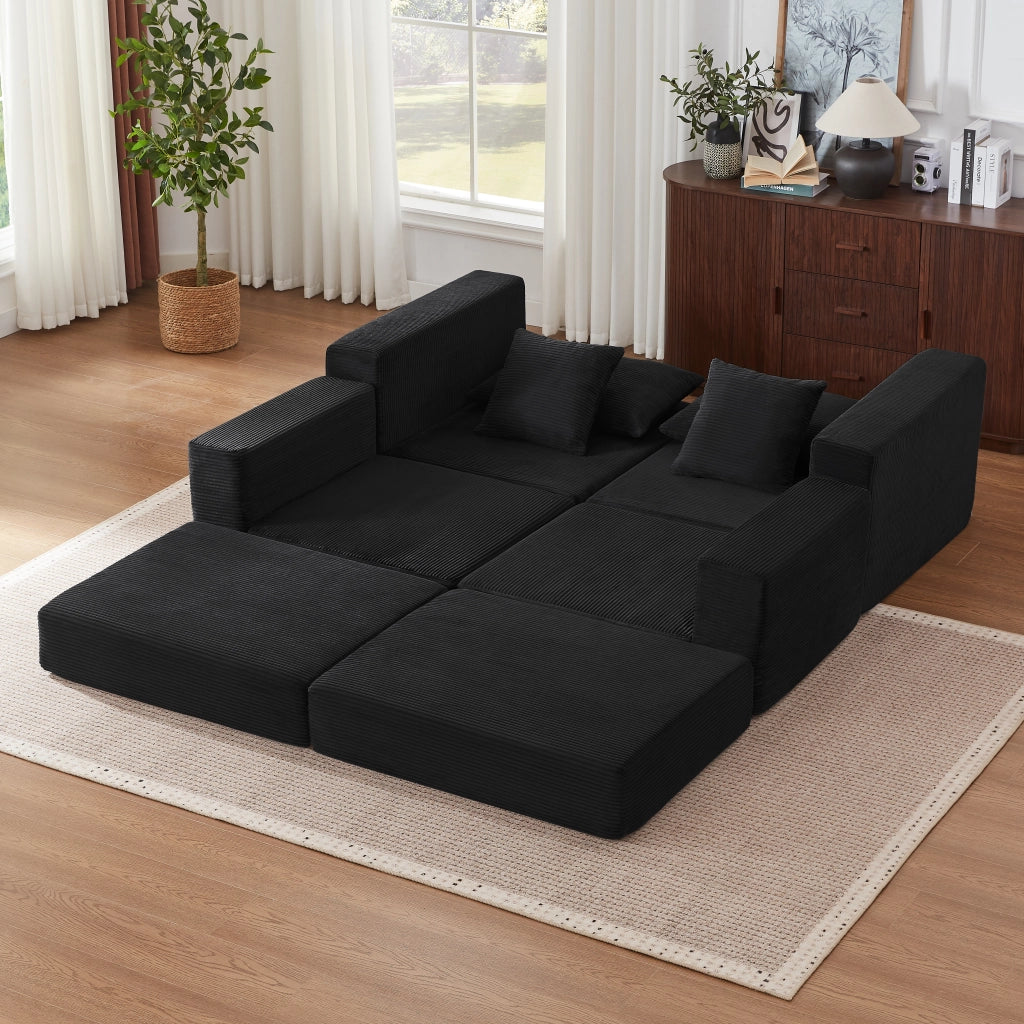 Divano modulare trasformabile in letto matrimoniale con braccioli oversize e base antiscivolo in tessuto a coste nero