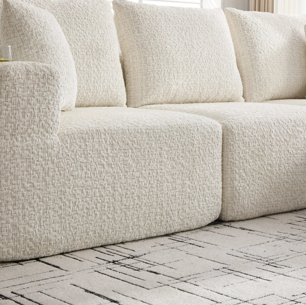 Divano angolare modulare beige in ciniglia con portabevande e tasche laterali