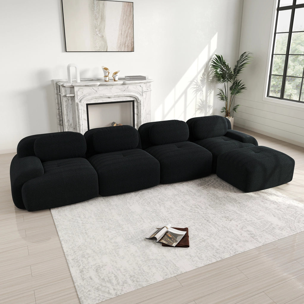 Divano angolare modulare in velluto a coste; seduta ergonomica; braccioli curvi; senza montaggio; nero