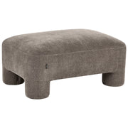 Rivestimento in tessuto marrone ottomano texture morbida gambe cilindriche stile organico