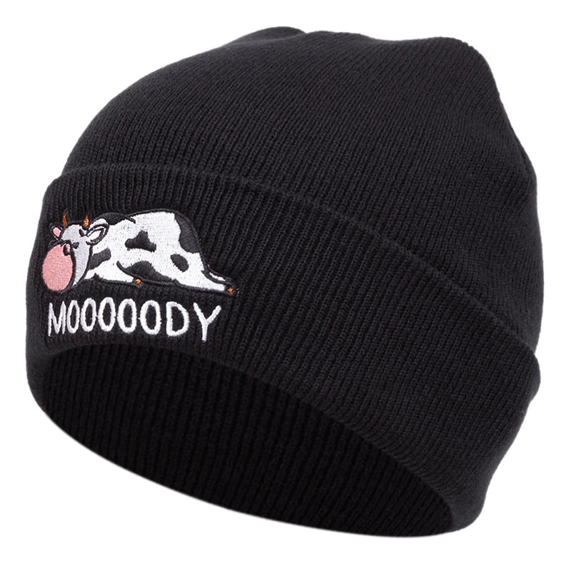 Cappelli neri con ricamo a forma di mucca