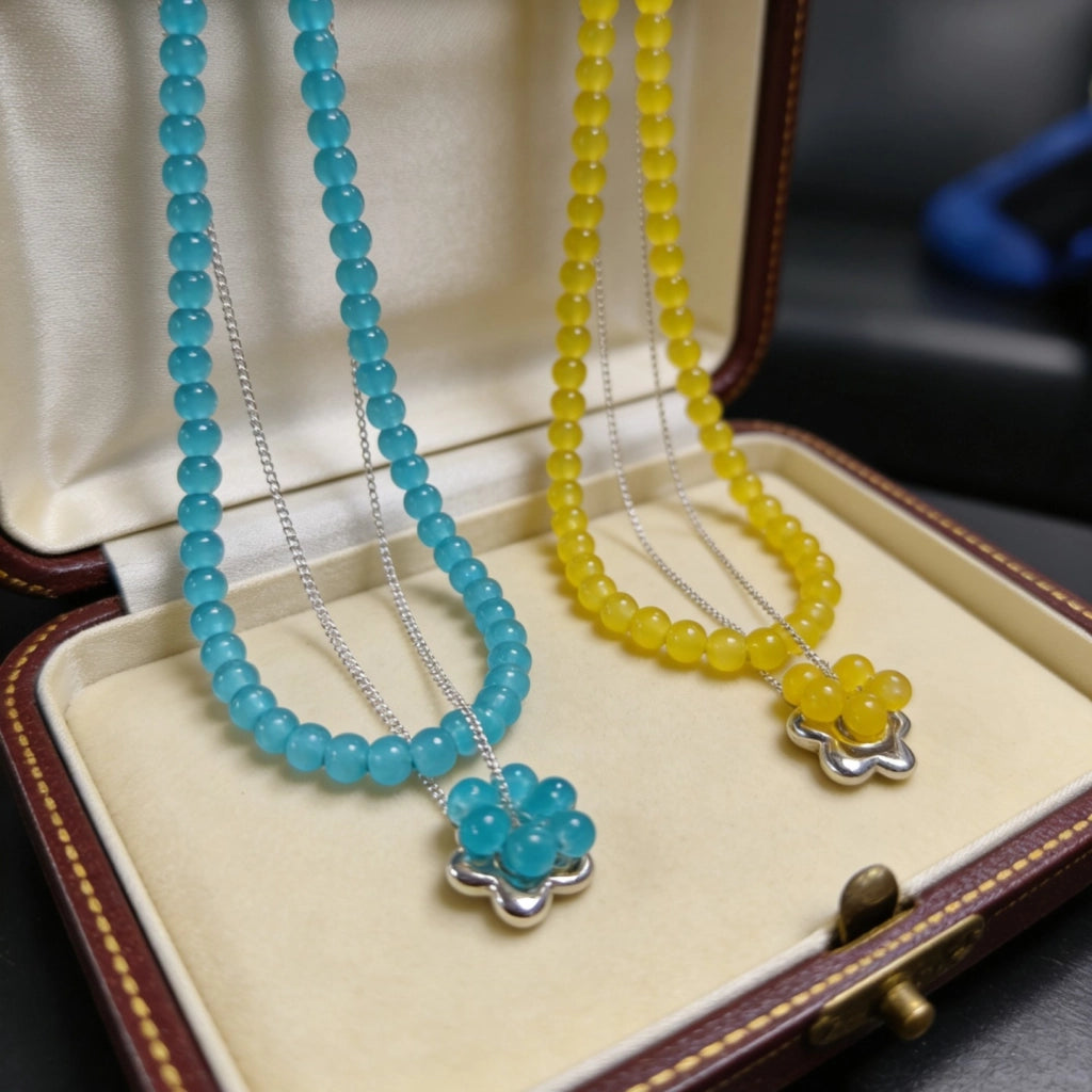 Collana a strati con fiori occhio di gatto