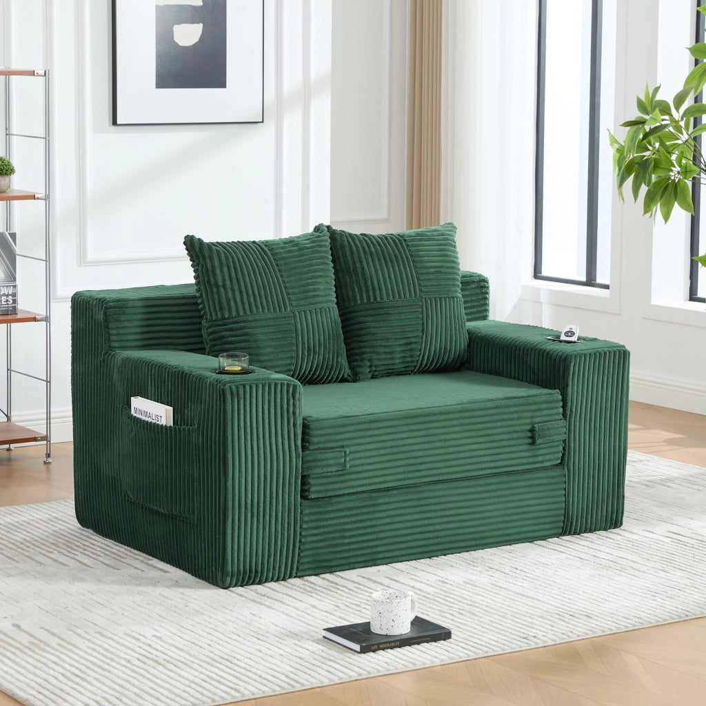 Divano pouf 151x133x64 cm con tasche laterali in velluto a coste smeraldo