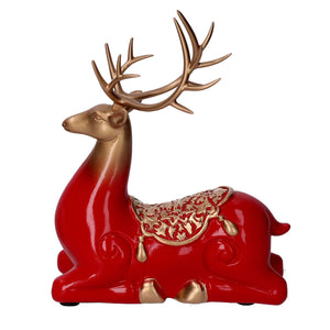 Renna resina seduta oro e rosso cm 17x8xh20