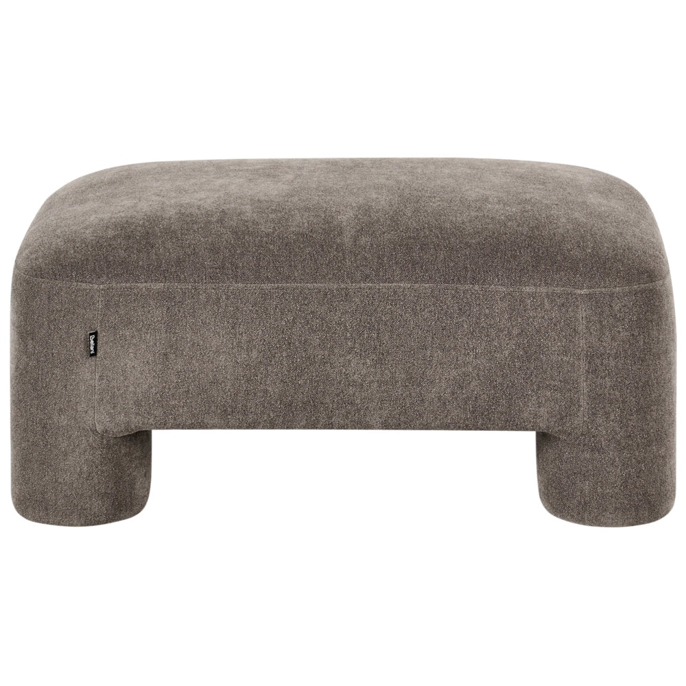 Rivestimento in tessuto marrone ottomano texture morbida gambe cilindriche stile organico