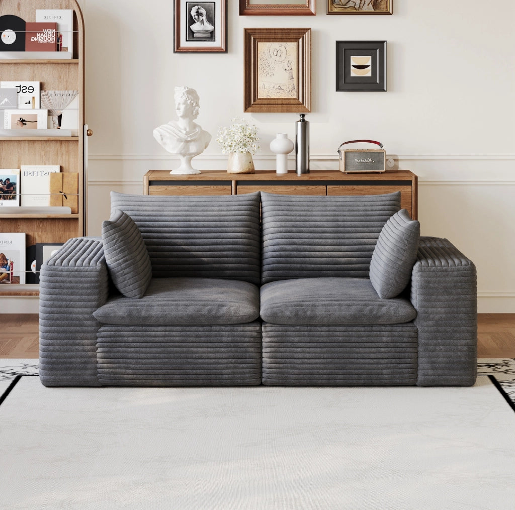 Divano modulare in tessuto grigio scuro con supporto in schiuma; design componibile
