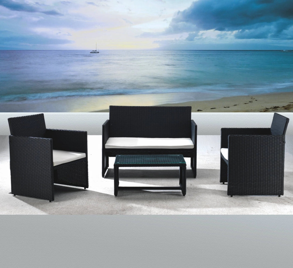 Salotto da esterno divano, due poltrone e tavolino, Polyrattan nero, cuscini bianchi  Fredi Cileva