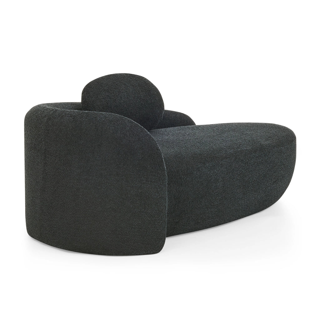 Divano minimalista in tessuto Teddy nero, imbottitura morbida e design salvaspazio
