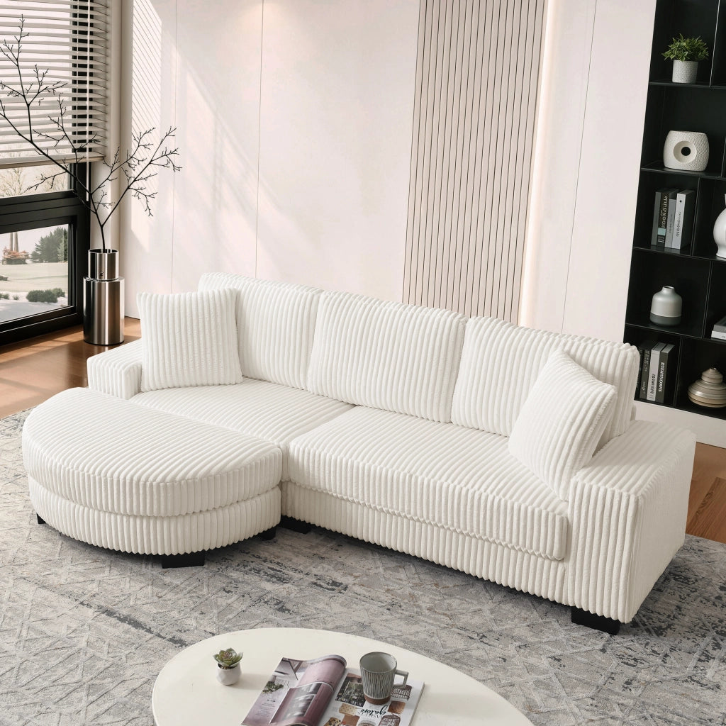 Divano angolare modulare 4 posti con pouf ovale reversibile e 2 cuscini in corduroy beige per soggiorno