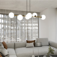 Sospensione Contemporanea Rhiannon 6 Luci In Acciaio Oro E Sfere In Vetro Bianco