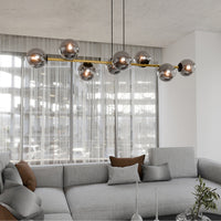 Sospensione Contemporanea Rhiannon 8 Luci In Acciaio Oro E Sfere In Vetro Fumè