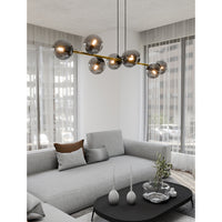 Sospensione Contemporanea Rhiannon 8 Luci In Acciaio Oro E Sfere In Vetro Fumè