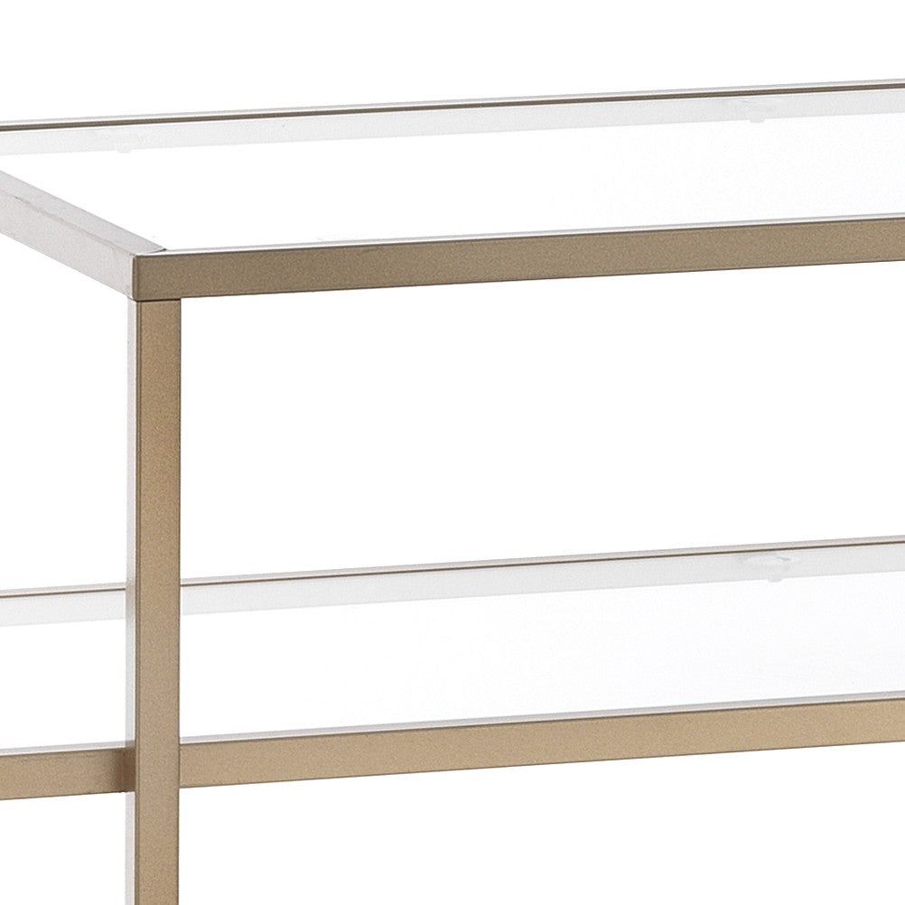 Consolle in acciaio finitura oro ripiani in vetro cm. H.84xL.118xP.38