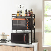 Scaffale per Microonde Sorsele Alto 79 cm Regolabile in Larghezza 40-63 cm Metallo Nero [en.casa]