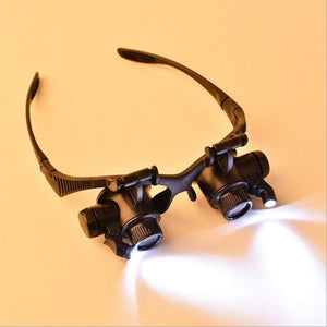 OCCHIALI LENTE INGRANDIMENTO 25 X PRECISIONE OCULARI 4 LENTI LUCI LED 9892G