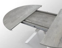 PAZZO DESIGN Tavolo Allungabile con Gambe Incrociate rotondo, Made in Italy, Basamento bianco, Grigio cemento