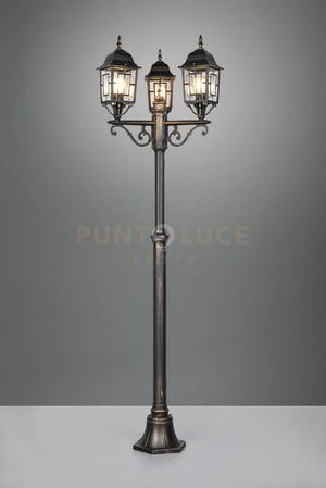 VOLTURNO PALO ALTO 3 LANTERNE DA ESTERNO 4 LATI FUSIONE DI ALLUMINIO RUGGINE CON DECORO IN FUSIONE SUL VETRO E VETRO TRASPARENTE H. 200CM IP44 3 LUCI ATTACCO E27