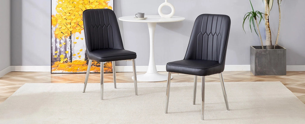 Sedia da pranzo nera in ecopelle con gambe metalliche argento, design moderno e minimale