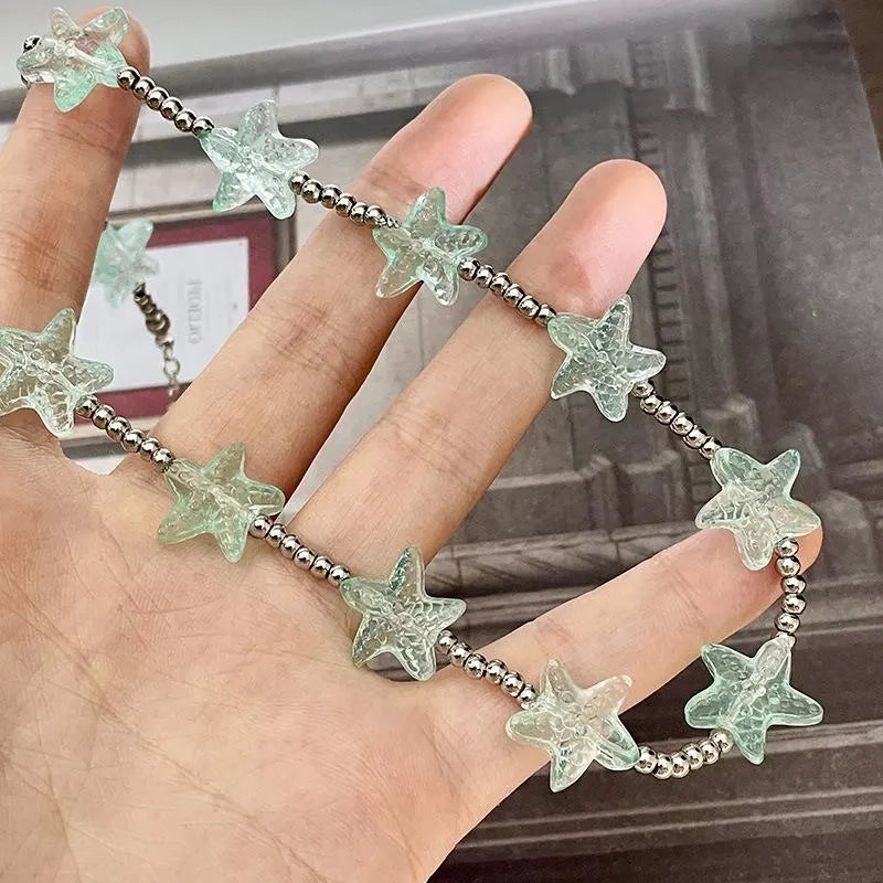 Set di gioielli boh¨¦mien fatti a mano con perline: bracciale, anello e collana.