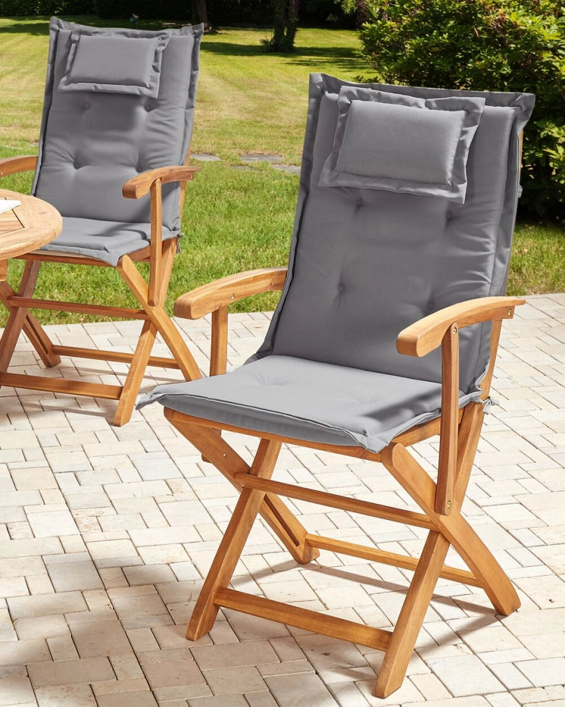Set di 2 sedie da pranzo da giardino Legno chiaro con cuscino grigio Struttura in legno di acacia Design rustico pieghevole