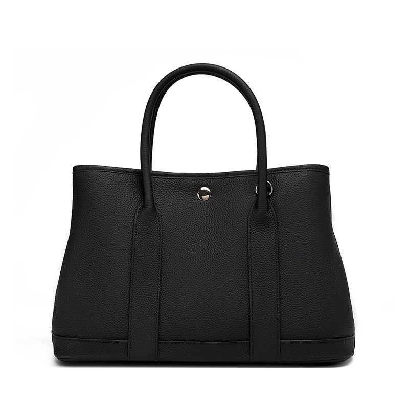 Borsa a mano e borsetta da donna in vera pelle, nera.