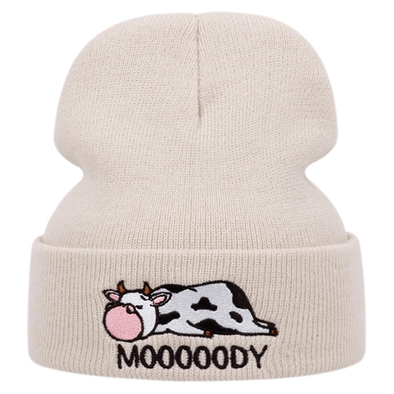 Cappelli ricamati con mucca color crema