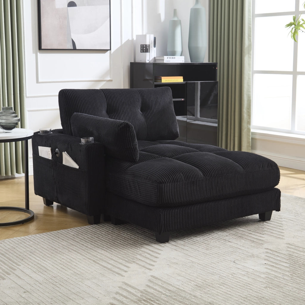 SEDIA LOUNGE in corduroy nero con braccioli reversibili, portabicchieri e porte USB