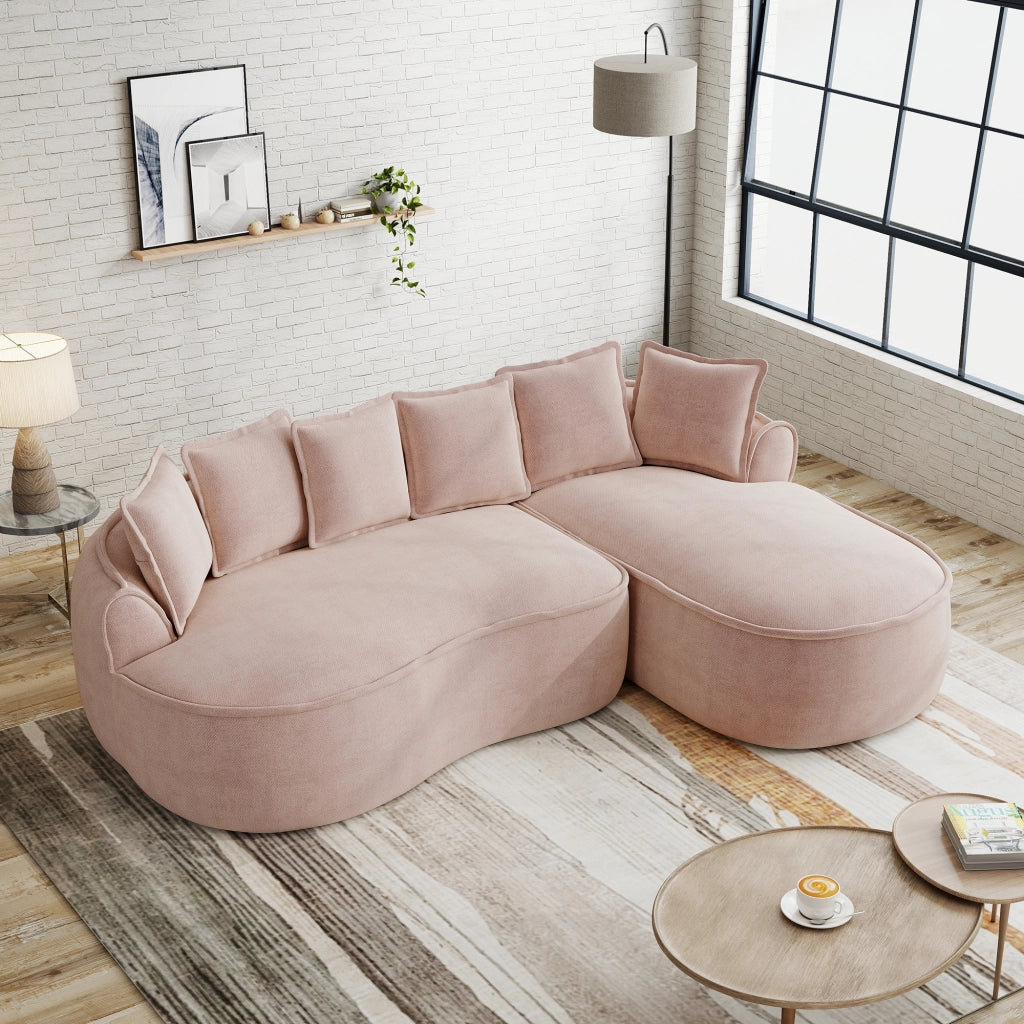 Divano modulare a L senza struttura in ciniglia con chaise longue profonda braccioli larghi e cuscini rosa