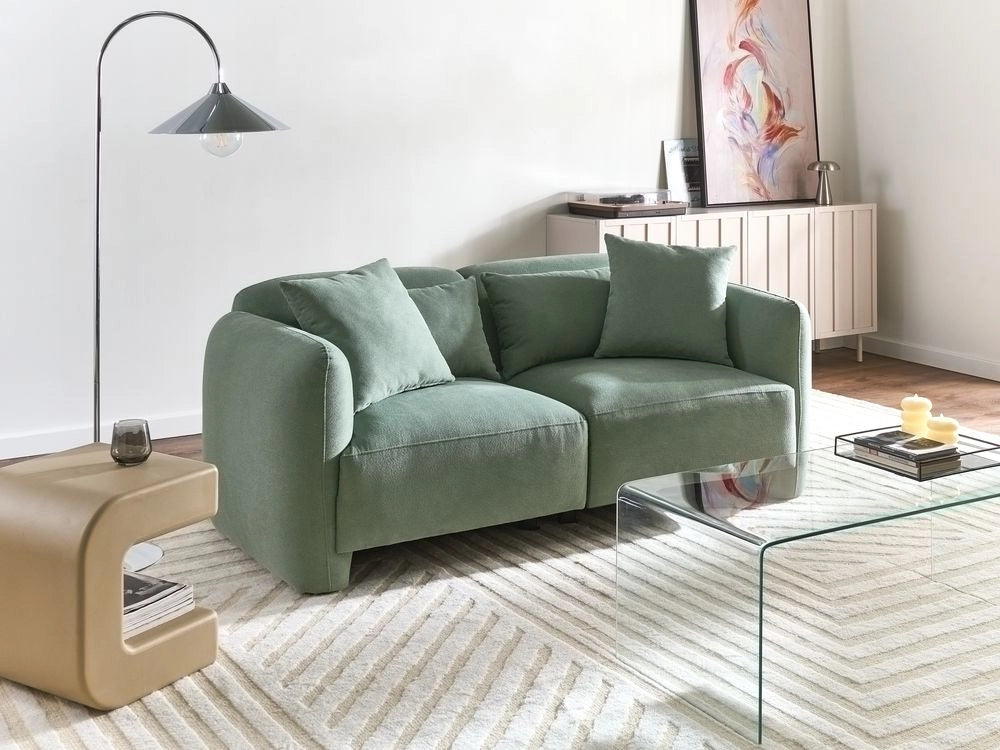 Divano imbottito minimalista a profilo ribassato a 3 posti con seduta profonda verde chiaro stile minimalista