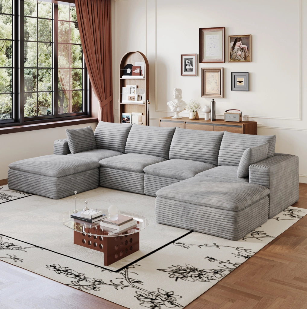 Divano modulare in tessuto grigio con supporto in schiuma; design componibile e imballo compresso
