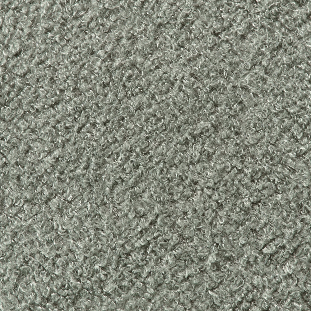 Poltrona da salotto con schienale curvo boucle verde stile glam elegante soggiorno