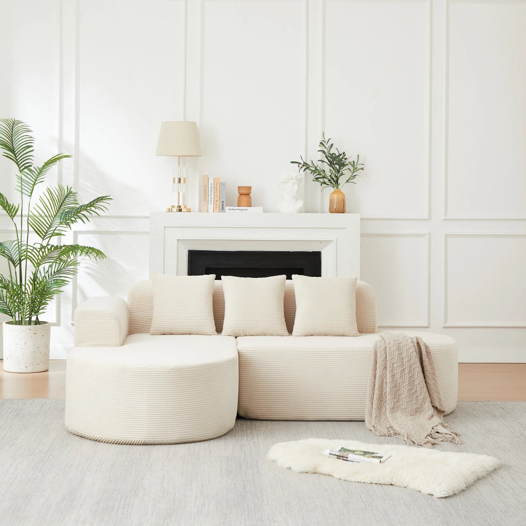 Divano modulare a L in velluto a coste beige con chaise longue curva; 220 cm