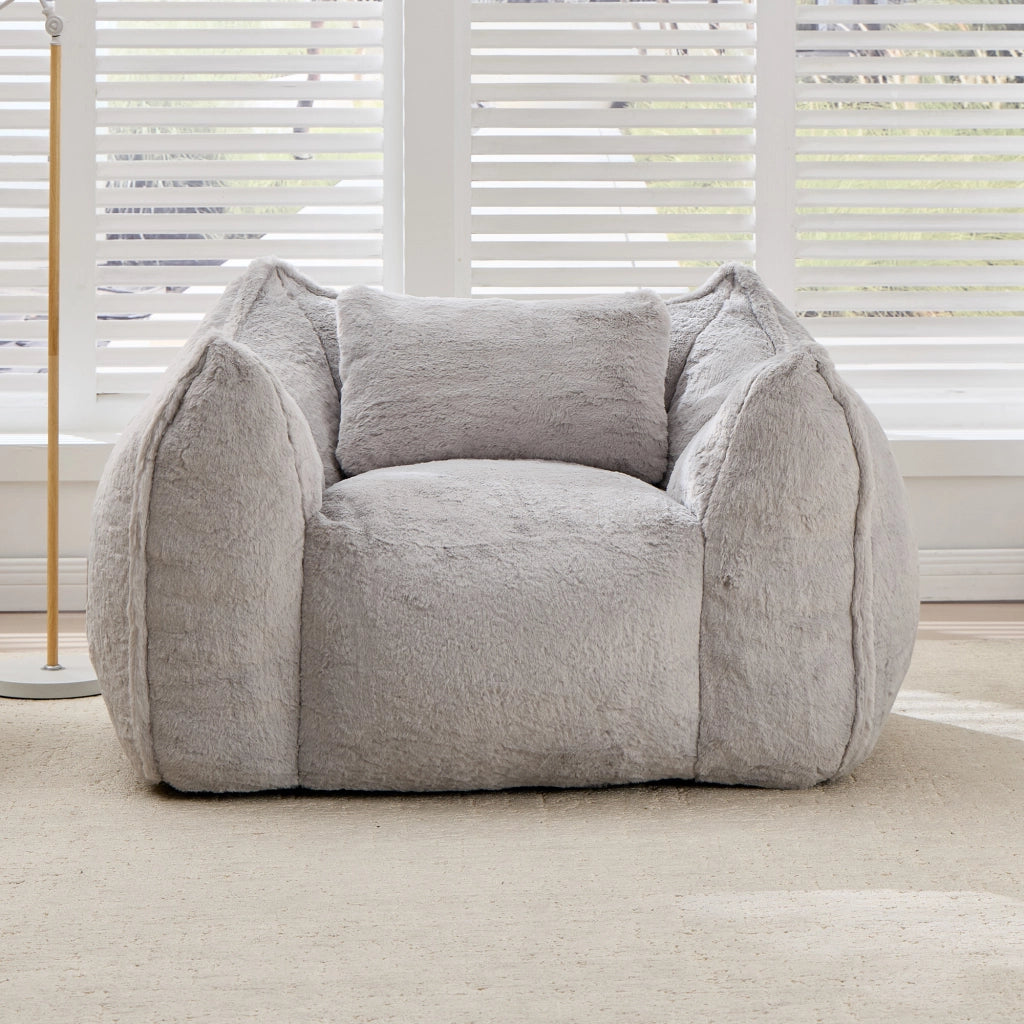 Poltrona pouf con schienale ergonomico e imbottitura in schiuma, in pelliccia sintetica grigia per soggiorno