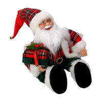 Babbo natale in tessuto rosso seduto con regali, musica e movimento cm xh35,5