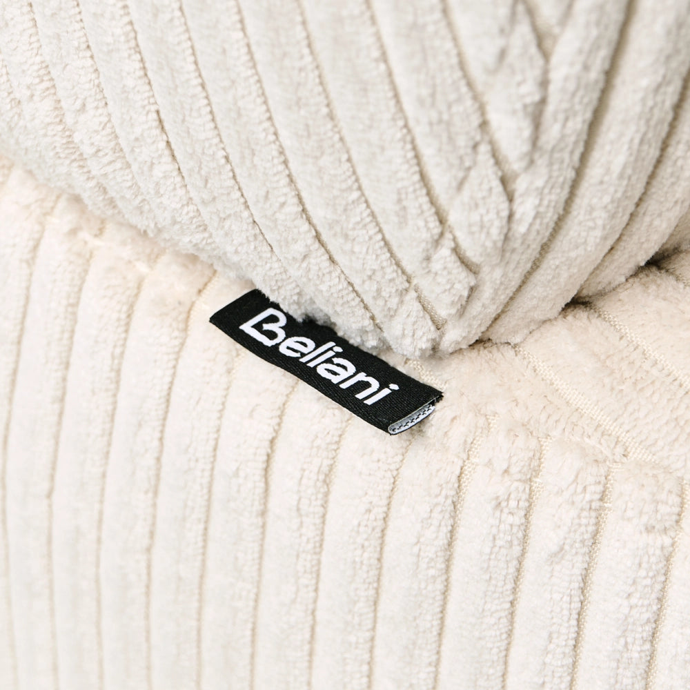 Chaise longue con rivestimento in velluto a coste beige e cuscino decorativo lato sinistro
