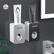 Dispensatore di dentifricio automatico, 2 pezzi dispensatore di dentifricio da parete, ABS di alta qualità, supporto adattabile con vite, senza fori, per bambini, adulti, bagno, la maggior parte dei dentifrici (nero/grigio)