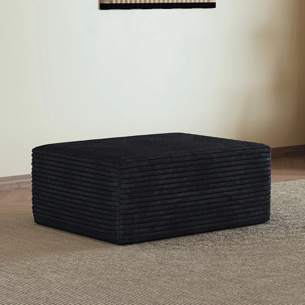 Pouf in tessuto effetto velluto a coste nero