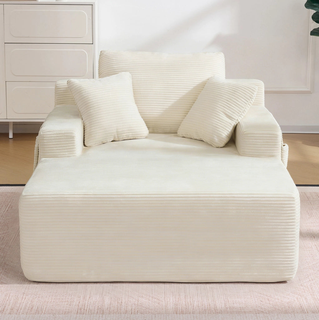 Divano ULEVR in velluto a coste beige con tasche laterali, cuscino schienale e 2 cuscini decorativi