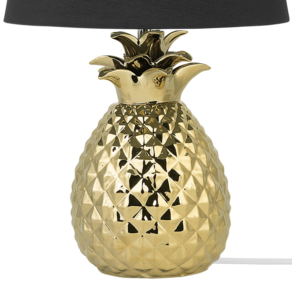 Lampada da tavolo decorativa dorato con base in ceramica nera lucida paralume in poliestere a forma di ananas dal design eclettico