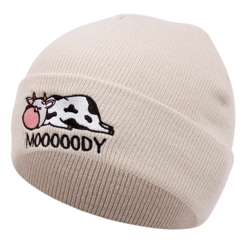 Cappelli ricamati con mucca color crema