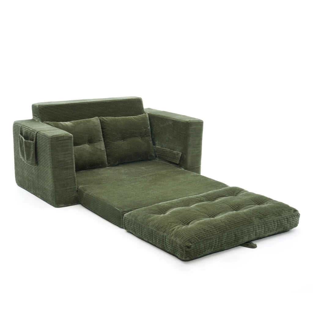 Divano 2 posti trasformabile in area relax; in velluto a coste verde con tasche laterali
